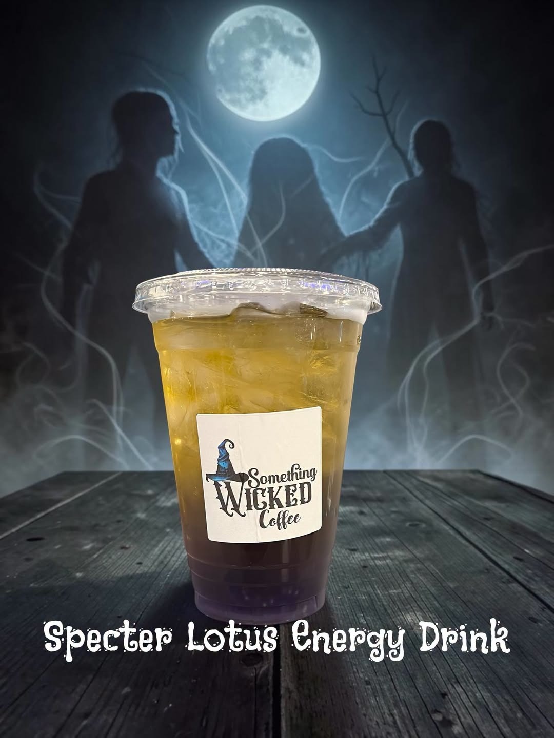 Specter Lotus Energy Drink in a Something Wicked Coffee cup under a full moon with witch silhouettes